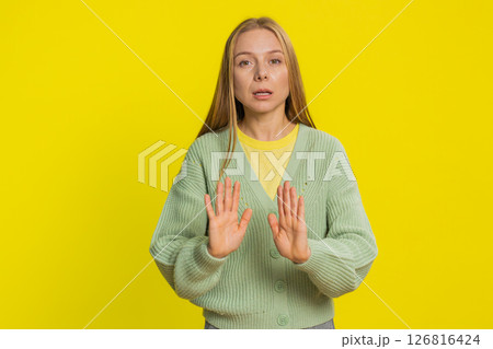 Strict mature woman warning hands gesture, saying no, be careful, advice to avoid danger, caution 126816424