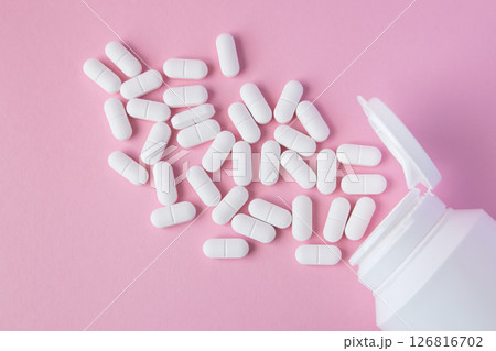 Much medical pills and drugs in white package on the pink background. Healthcare concept. Space for text. Much medical pills and drugs in white package on the pink background. Healthcare concept. Space for text. 126816702