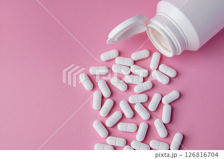 Much medical pills and drugs in white package on the pink background. Healthcare concept. Space for text. Much medical pills and drugs in white package on the pink background. Healthcare concept. Space for text. 126816704
