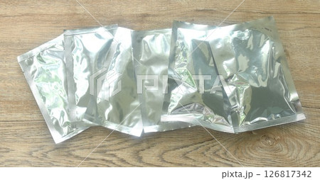 snack package aluminum foil mock-up arranging on table snack package aluminum foil mock-up arranging on table 126817342
