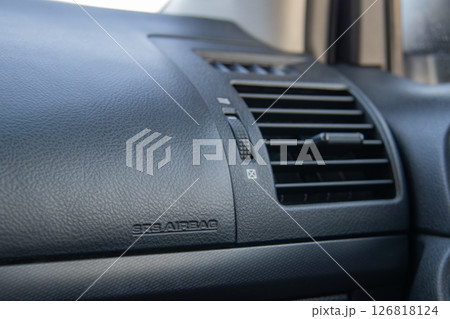 Car air conditioning. Car ventilation close-up. Passenger airbag. 126818124