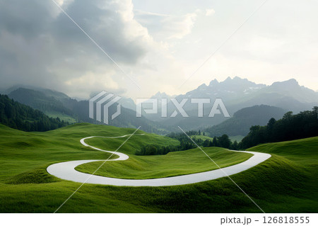 winding dirt path leads through lush alpine valley with vibrant wildflowers, surrounded by green meadows and majestic snow capped peaks under bright blue sky. 126818555