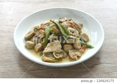 stir fried green pea and straw mushroom with pork in soybean sauce on plate stir fried green pea and straw mushroom with pork in soybean sauce on plate 126820175