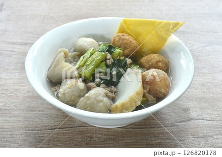boiled fish ball with dumpling topping shrimp ball and morning glory in clear soup on bowl 126820178