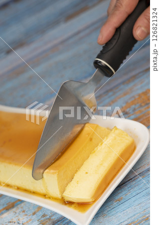 Cream caramel pudding with caramel sauce on a plate, Flan 126821324