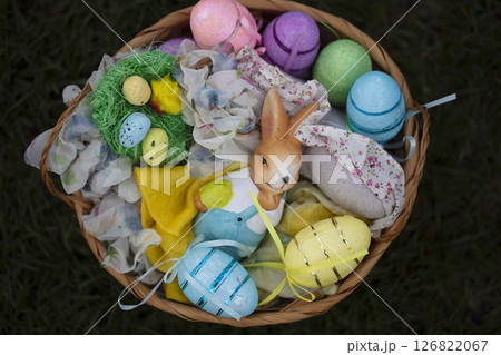 Easter basket with decorative eggs and bunny figurine. Easter basket with decorative eggs and bunny figurine. 126822067