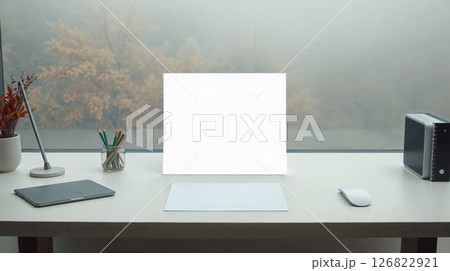 Art photo of desk with paper. Candlelight warms the wood, smooth texture. 126822921
