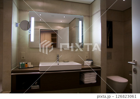 Mainz, Germany, July 8, 2017: Hotel Bathroom with Sink, Mirror, and Bright Tiles 126823061