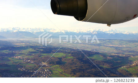 Zurich, Switzerland, April 15, 2015: BAe 146 Wing View over Swiss Landscape 126823239