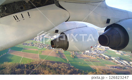 Zurich, Switzerland, April 15, 2015: BAe 146 Wing View over Swiss Landscape Zurich, Switzerland, April 15, 2015: BAe 146 Wing View over Swiss Landscape 126823247