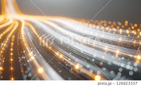 Abstract long exposure light trails with glowing bokeh effects in golden white tones on dark background 126823337