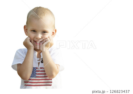 Little boy in clothes with a print of the American flag isolated on a white background. 126823437