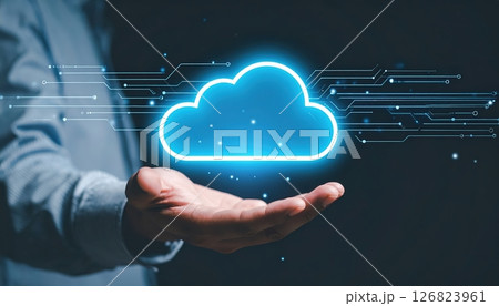 Digital Cloud Computing Technology Concept with Hand Holding Glowing Cloud Icon and Data Streams 126823961