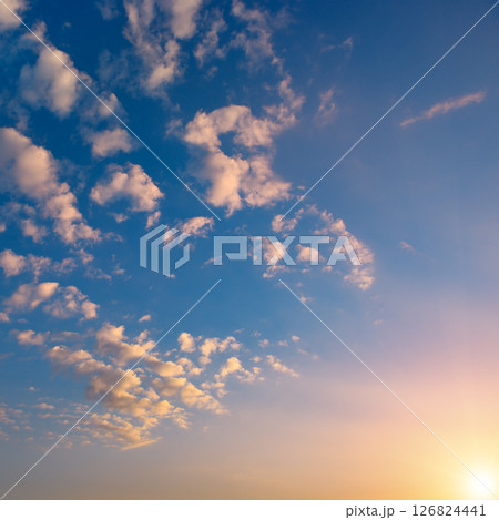 Sunset with bright sun, blue sky and pink clouds 126824441