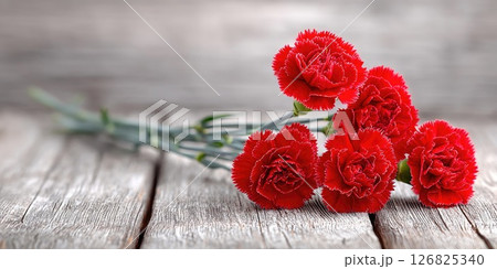 Fresh Red Carnations on Rustic Wooden Background 126825340