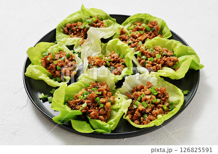 Fresh and Crispy Ground Chicken lettuce wraps Fresh and Crispy Ground Chicken lettuce wraps 126825591