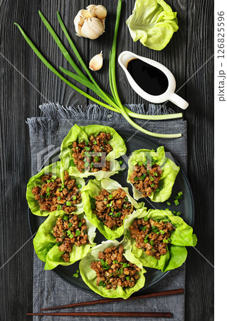 Fresh and Crispy Ground Chicken lettuce wraps 126825596