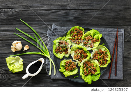 Fresh and Crispy Ground Chicken lettuce wraps 126825597
