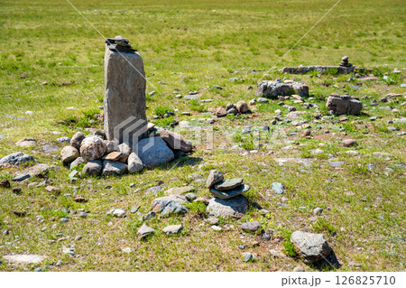 Vertical stone slabs known as Inin steles forming a sacred site near Chuysky Trakt Altai Russia. Spiritual monument used for prayers and worship by Altai people Vertical stone slabs known as Inin steles forming a sacred site near Chuysky Trakt Altai Russia. Spiritual monument used for prayers and worship by Altai people 126825710
