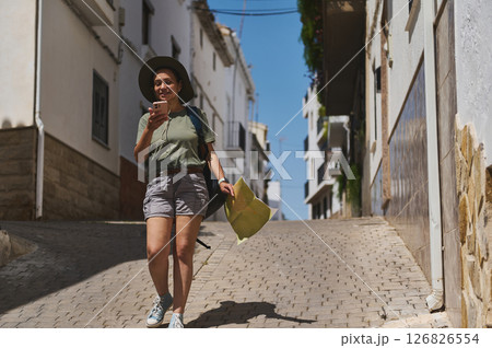 Traveler Exploring Historic Alley in a Picturesque Spanish Village 126826554