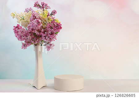 Abstract floral arrangement with purple lilac flowers, banner.Empty podium with spring lilac flowers. Creative template for your design.Minimal modern aesthetics, elegant beauty concept 126826605