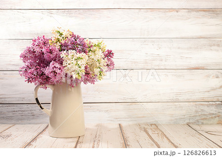 Abstract floral arrangement and banner for screen.Still life with beautiful spring flowers blooming white lilac in vase on elegant background,floral holiday card with summer greeting concept 126826613