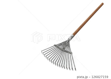 Metal fan rake with wooden handle. Space for text. 126827159