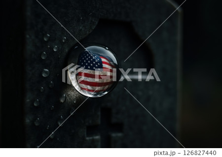 American Flag Reflected in Water Droplet on Tombstone 126827440