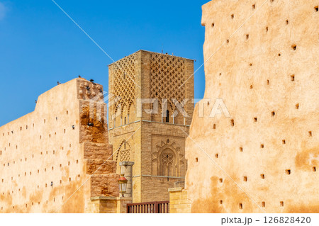 Hassan Tower ancient incomplete mosque minaret and surrounding walls, Rabat, Morocco 126828420