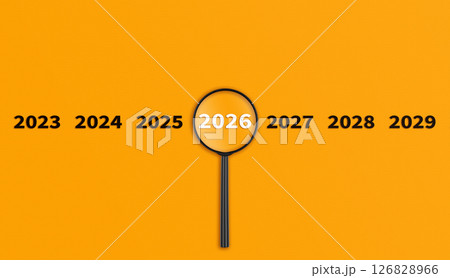 Lens, magnifying glass focusing on the year 2026 on a Orange background. Financial or stock market strategies and past and future events. Lens, magnifying glass focusing on the year 2026 on a Orange background. Financial or stock market strategies and past and future events. 126828966