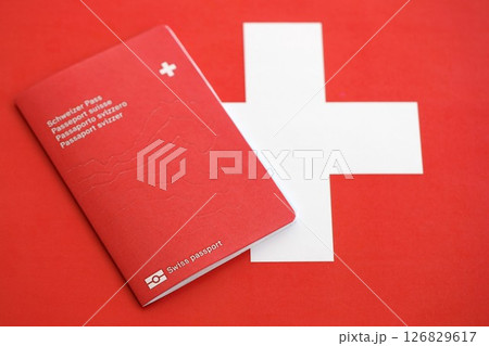 Swiss passport on flag. The current Swiss pass on flag close up 126829617
