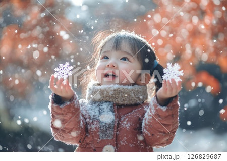 Asian child enjoying snowfall in winter wonderland. Neural network AI generated 126829687