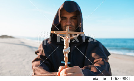 Jesus Crucifix In The Hands Of A Hooded Priest Jesus Crucifix In The Hands Of A Hooded Priest 126829801