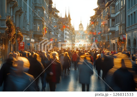 Festive gathering of people in a bustling street city center urban scene sunset light joyful atmosphere 126831533