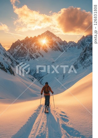 Skier conquering majestic snow-capped mountains at sunrise winter landscape scenic view 126831808