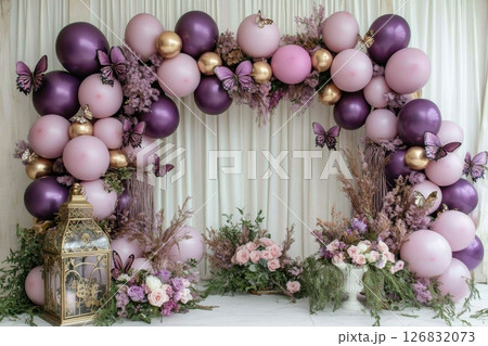 Elegant balloon arch decor with butterflies for stunning events indoor setting floral design 126832073