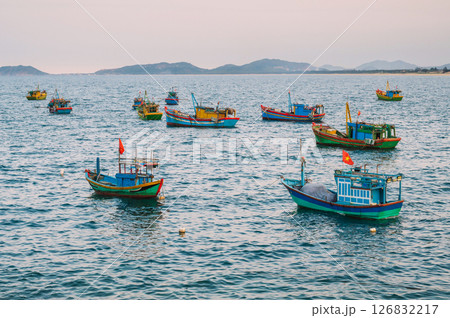 Vietnamese fishing boats and vessels sail in the sea in bay Vietnamese fishing boats and vessels sail in the sea in bay 126832217