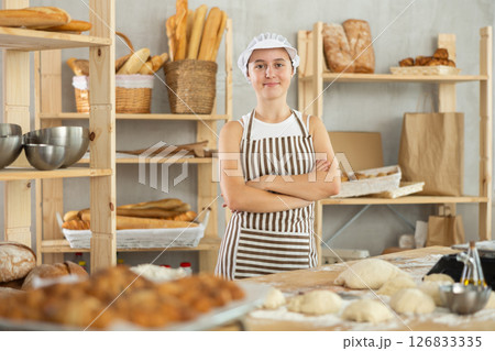 Teenage girl standing in bakehouse, ready to start baking 126833335