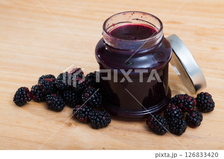 Blackberries and jar of jam 126833420