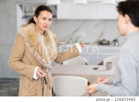 Mother leaving house, son staying home 126833483
