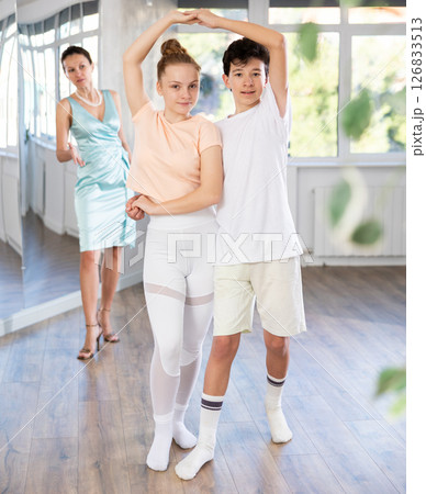 Girl and boy dancing slow ballroom dance in choreography studio 126833513