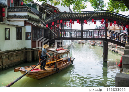 Paddle boat through bridge to city god temple, Zhujiajiao, Shanghai Paddle boat through bridge to city god temple, Zhujiajiao, Shanghai 126833963