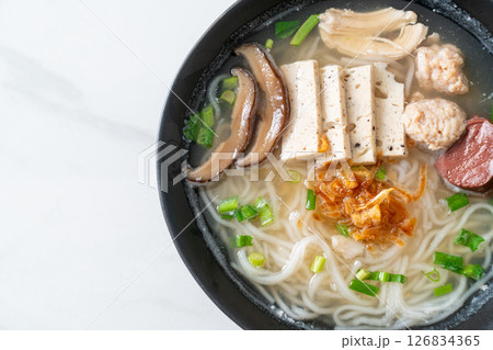 Vietnamese Rice Noodles Soup with Vietnamese Sausage served vegetables and crispy onion 126834365