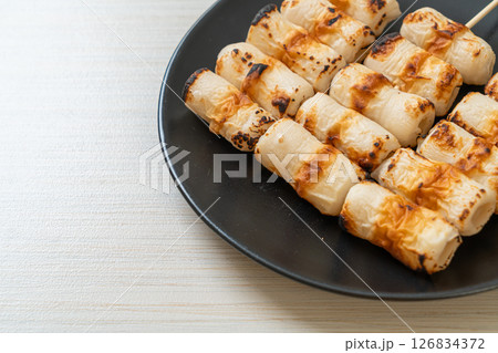 grilled tube shaped fish paste cake skewe or tube squid skewer 126834372