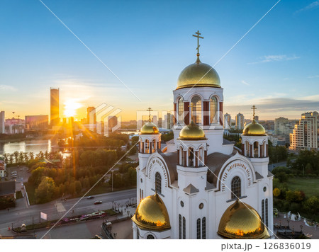 Summer Yekaterinburg and Temple on Blood in beautiful clear sunset.. Aerial view of Yekaterinburg, Russia. Translation of the text on the temple: Honest to the Lord is the death of His saints. Summer Yekaterinburg and Temple on Blood in beautiful clear sunset.. Aerial view of Yekaterinburg, Russia. Translation of the text on the temple: Honest to the Lord is the death of His saints. 126836019