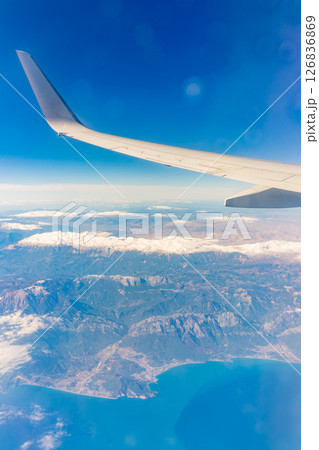 View from the airplane window of the mountains and sea resort with corals in Egypt, Sharm El Sheikh.Flight 126836869