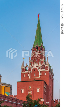Troitskaya tower of Moscow Kremlin on a blue sky background in sunny summer day 126837497