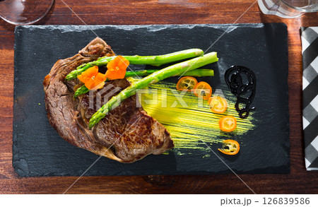 Well done beef steak with asparagus Well done beef steak with asparagus 126839586