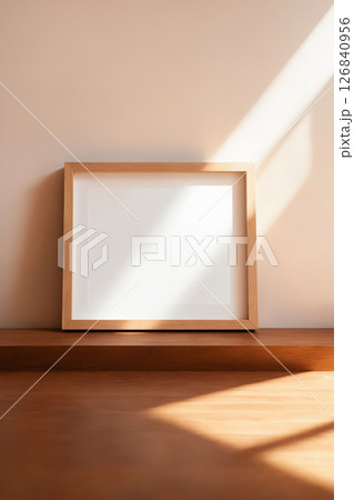 Blank picture frame on wall background with sunlight shades 126840956