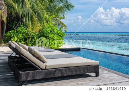 Luxury Beachfront Resort Poolside Relaxation Luxury Beachfront Resort Poolside Relaxation 126841410